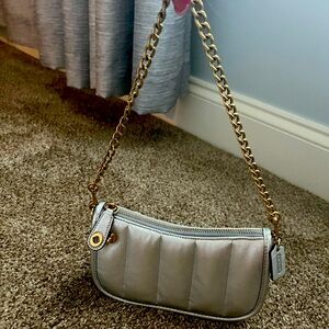 Like new Coach metallic leather clutch